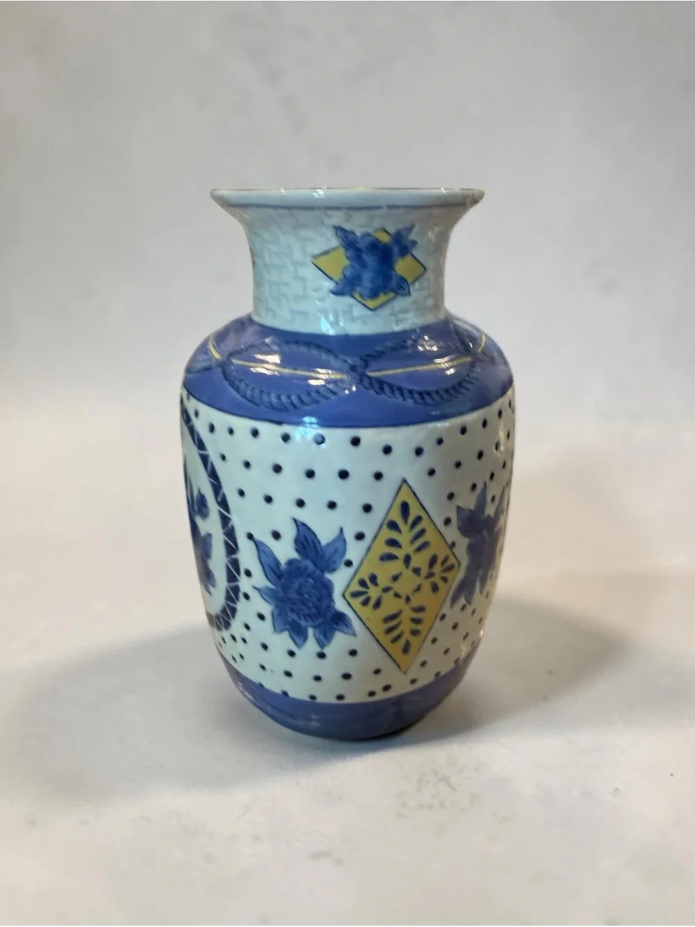 Vintage Porcelain Vase with Blue and White Floral Motif and Yellow Accents